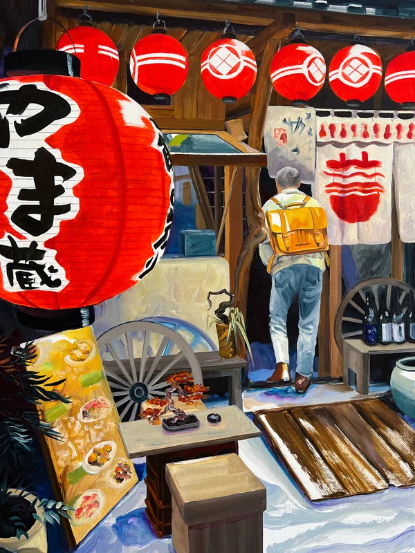 Aurélie Quentin souriante devant son exposition d'art japonais sur les izakayas